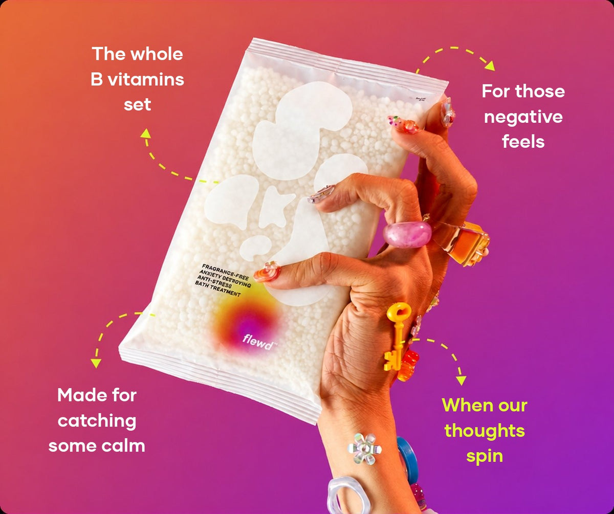 Fragrance-free Anxiety Destroying pouch in a hand with colorful rings, part of the Flewd Stresscare Trio
