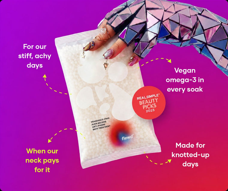Fragrance-free Ache Erasing pouch held by a mirrored glove, part of the Flewd Whole Mood Bundle