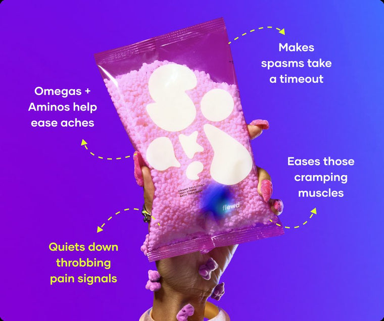 Flewd Cramp Deleting bath soak pouch held up on a purple background, for cramp days