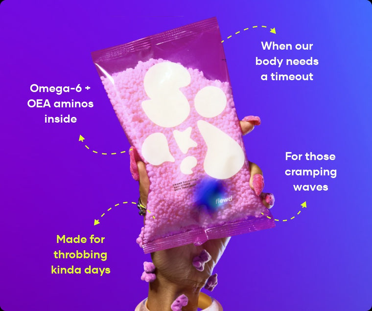 Flewd Cramp Deleting bath soak pouch held up on a purple background, for cramp days