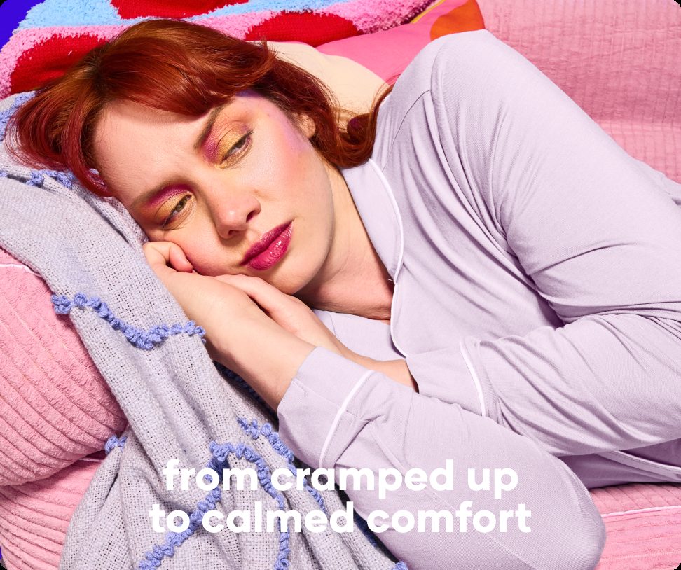 Woman resting on a pink bed