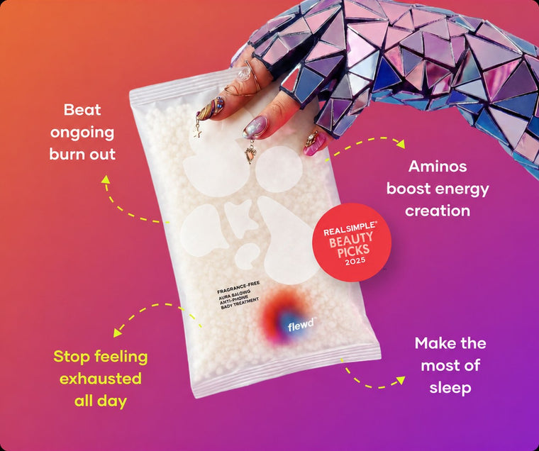 Fragrance-free Ache Erasing pouch held by a mirrored glove, part of the Flewd Stresscare Trio