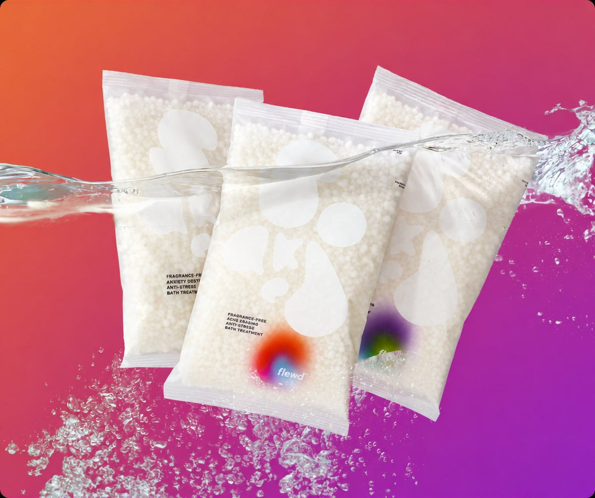 Three fragrance-free Stresscare Trio magnesium bath soak pouches with a water splash