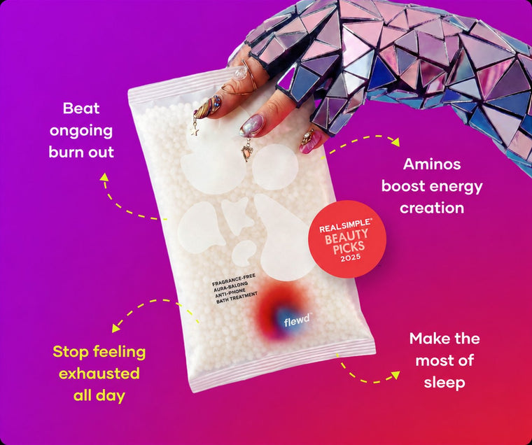 Fragrance-free Ache Erasing pouch held by a mirrored glove, part of the Flewd Whole Mood Bundle
