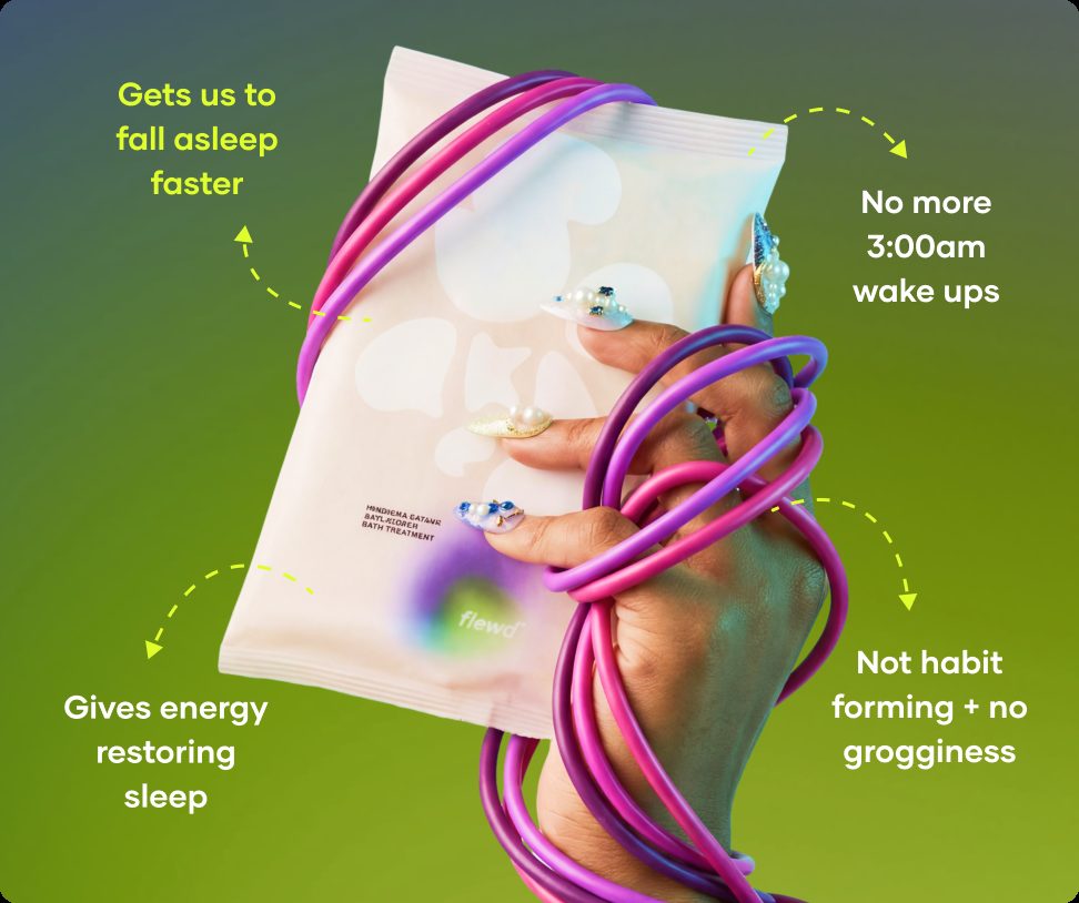 Flewd Insomnia Ending bath soak pouch held in a hand wrapped in purple cables, for sleepless nights