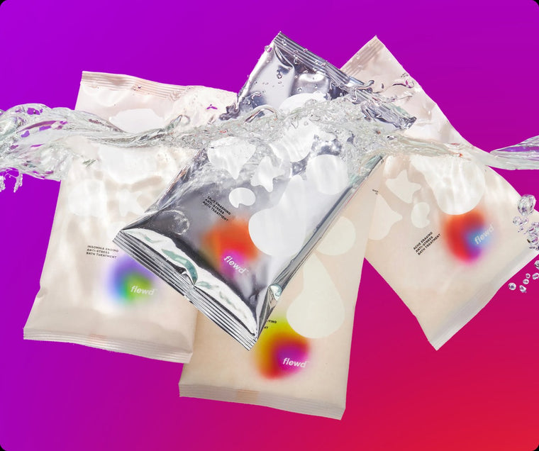 Four Whole Mood Bundle magnesium bath soak pouches with a water splash