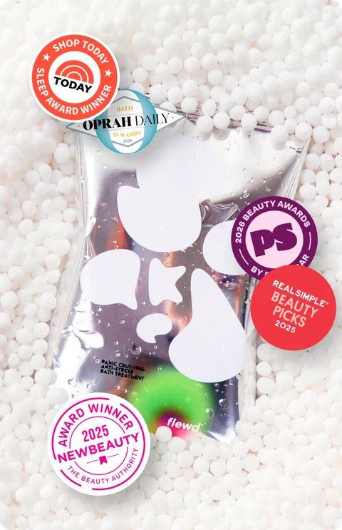 flewd soak pouch on white bath beads with Today, Oprah Daily, PopSugar, Real Simple and NewBeauty award seals